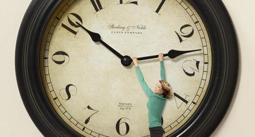 Woman hanging on clock hand